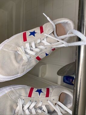 Beige Suede Sneakers with Red Stripes and Blue Star Detail